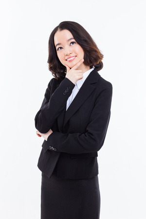 Thinking young Asian woman isolated on whiteの写真素材