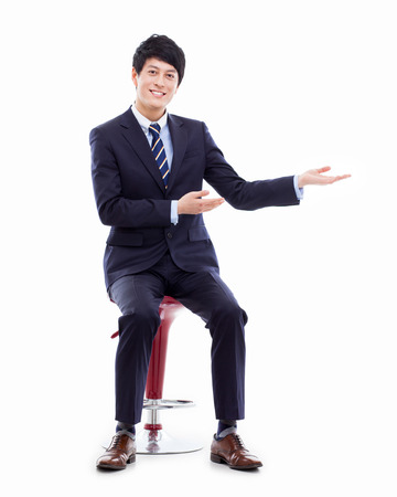 Young Asian business man showing somethingの写真素材