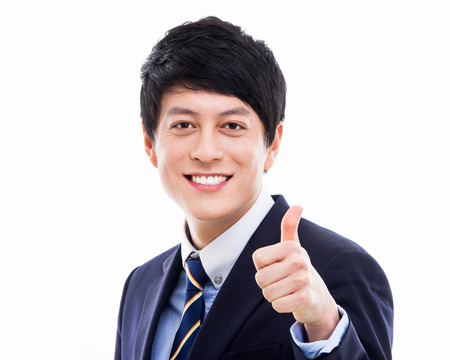 showing thumb Asian young business man close up shotの写真素材