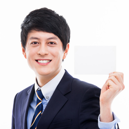 Asian young business man with blank cardの写真素材