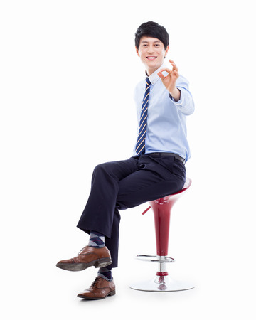 Young Asian business man showing okay sign の写真素材