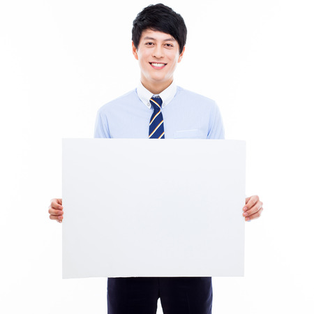 Young Asian business man holding a blank banner の写真素材