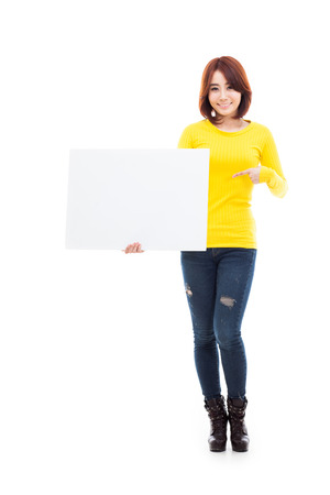 Asian woman showing banner isolated on white background.の写真素材