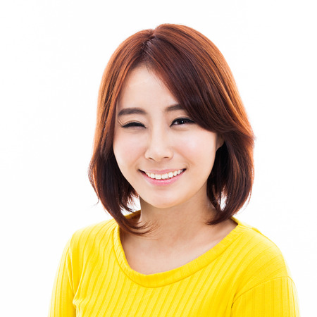 Happy young Asian woman close up shot isolated on white background. の写真素材