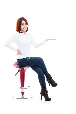 Asian woman present something isolated on white background. の写真素材