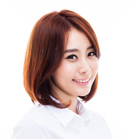 Happy young Asian woman close up shot isolated on white background.の写真素材