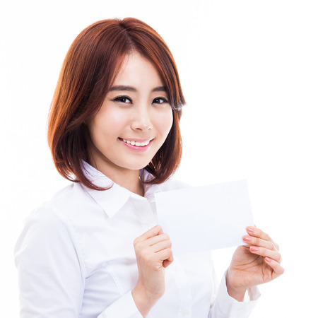 Asian woman showing empty card isolated on white background.の写真素材