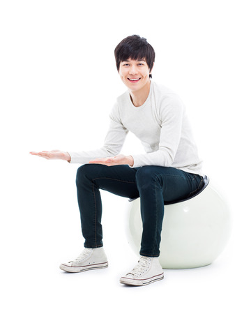Asian man present something isolated on white background.の写真素材