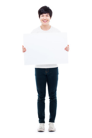 Asian young man showing pannel isolated on white background. の写真素材