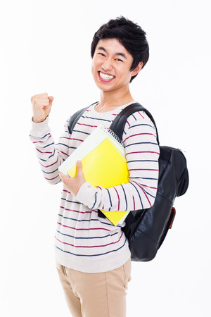 Young Asian stdudent showing fist isolated on white background.の写真素材