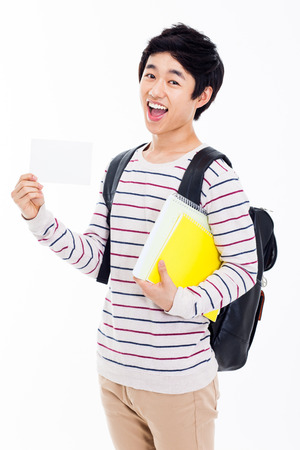 Young Asian stdudent showing card isolated on white background.の写真素材