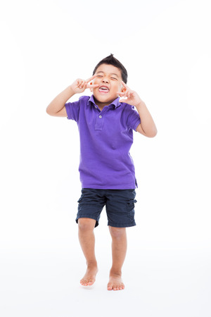 Young happy Asian boy isolated on white background.の写真素材