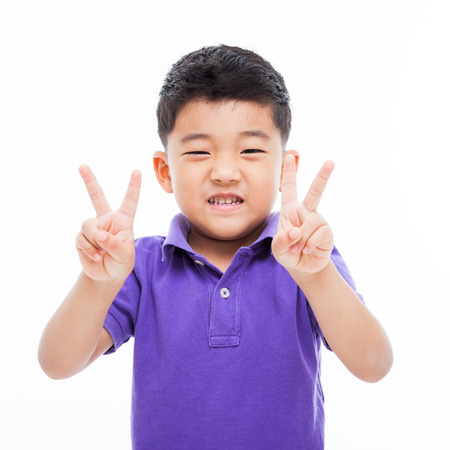 Happy Asian boy isolated on white background.の写真素材