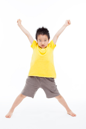 Young Asian child hands up isolated on white.の写真素材