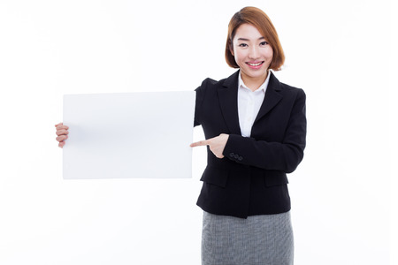 Young Asian business woman holding a blank banner isolated on white background.の写真素材