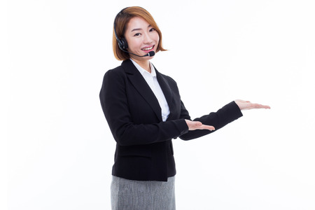 Smiling call center operator business woman isolated on white background.の写真素材