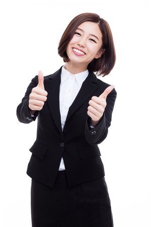 Successful happy Asian businesswoman showing thumb isolated on white background.の写真素材