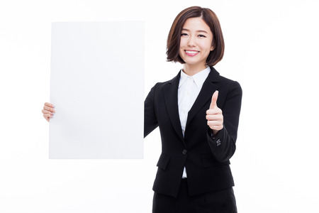 Young Asian business woman holding a blank banner isolated on white background.の写真素材
