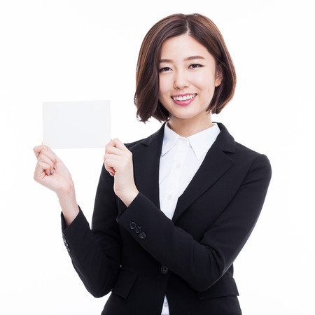 Business woman showing blank card. isolated over whiteの写真素材