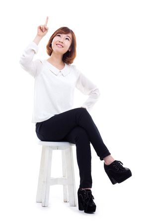 Asian woman present something isolated on white background.の写真素材