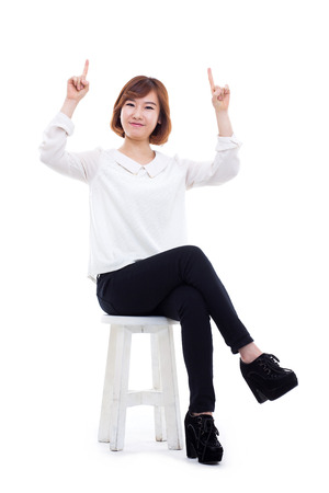 Asian woman present something isolated on white background.の写真素材