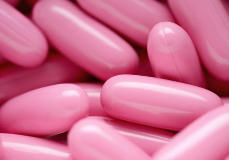 The group of pink capsules helping the healthy lifestyle