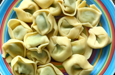 Tortellini stuffed with the spinach on the plateの写真素材