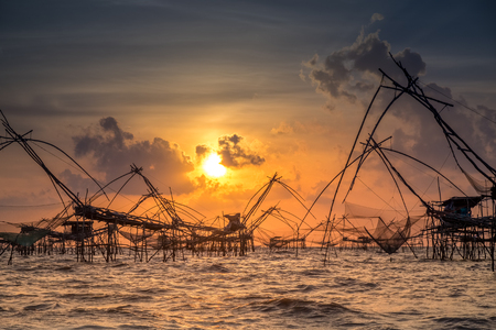 Landscape of fisherman's village in Thailand with a number of fishing tools called "Yok Yor", Thailand's traditional fishing tools that made form bamboo and fishing net. Can be found in the southern area of Thailand.の写真素材