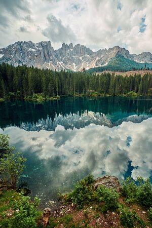 Landscape of Carezza Lake, a small alpine lake in the Dolomites in South Tyrol, Italyの写真素材