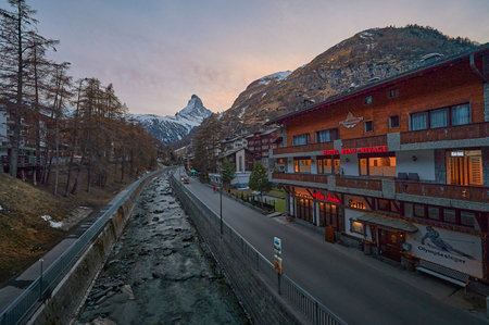 ZERMATT, SWITZERLAND - APR 11, 2022: A landscape of Matterhorn mountain at sunset with Matter Vispa river in the foreground.のeditorial素材
