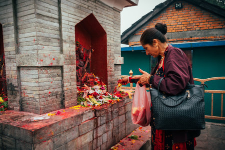 Pokhara, Nepal - Apr 15, 2023: Nepali people gather at Bindhyabasini Temple in Pokhara to celebrate Navavarsha (Nepali New Year Event) and perform Puja rituals, offering prayers to their gods.のeditorial素材