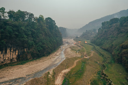 The famous Bhalam suspension bridge near Pokhara offers a breathtaking view of the Seti riverbank, attracting tourists to admire the scenic landscape.の写真素材