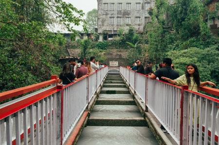 Pokhara, Nepal - Apr 15, 2023: Tourists and Nepali people visiting Seti River Gorge, a famous tourist atrraction in Pokhara city, Nepalのeditorial素材
