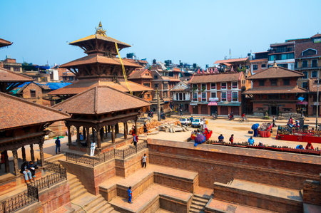 Lalitpur, Nepal - Apr 17, 2023: A landscape around Patan Durbar Square with tourists and locals walking and sightseeing around. Located in the city of Lalitpur, Kathmandu Valley, Nepal.のeditorial素材