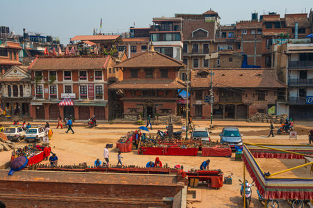 Lalitpur, Nepal - Apr 17, 2023: A landscape around Patan Durbar Square with tourists and locals walking and sightseeing around. Located in the city of Lalitpur, Kathmandu Valley, Nepal.のeditorial素材