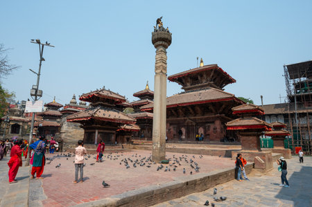 Kathmandu, Nepal - Apr 17, 2023: A landscape of Jagannath Temple, a Buddhist monastery located in Kathmandu Durbar Square, with tourists and locals visiting on a sunny day.のeditorial素材