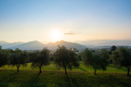 A landscape of the countryside near Iseo Lake at sunrise near the cities of Brescia. Iseo Lake also known as Sebino, is the fourth largest lake in Lombardy, Italyの写真素材