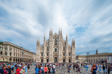 MILAN, ITALY - SEP 3, 2022: Tourists and locals visiting Cathedral Square (Piazza del Duomo) and Duomo di Milano (Milan Cathedral), the cathedral church of Milan, Lombardy, Italy.のeditorial素材