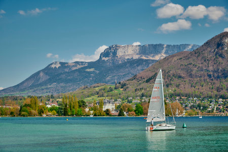 Haute-Savoie, France - Apr 14, 2022: Tourists boarding a boat at Lake Annecy on a sunny day.のeditorial素材