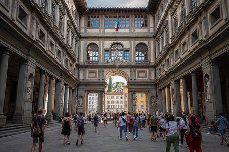 Florence, Italy - Aug 8,2023: visitors walking through the courtyard of the famous Uffizi Gallery in Florence, Italy.のeditorial素材