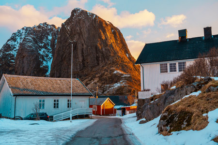 Scenic view of Hamnoy in Lofoten Island with snow-capped mountains in the background at sunset.の写真素材