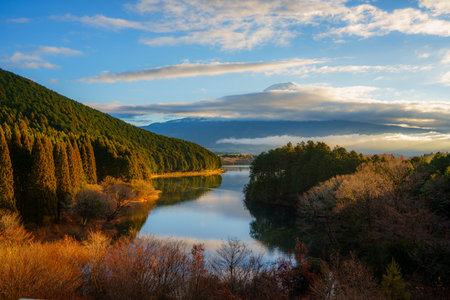 Mount Fuji with lake reflection and vibrant sunrise near Fujinomiya.の写真素材