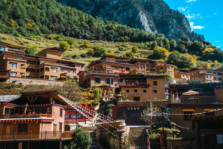 A picturesque view of the ancient, terraced Bala Village nestled in the mountains of Shangri-La.の写真素材