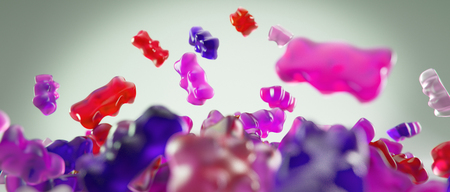 Transparent pink sweet gummy bears falling backgroundの写真素材