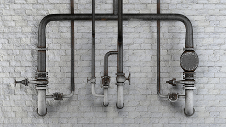 Set of old, rusty pipes and valves against white classic brick wallの写真素材