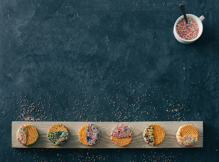 ice cream on a stick lies on a wooden background in different positionsの写真素材