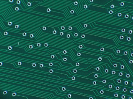 Close up electronics parts on green board