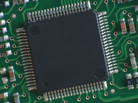 Close up electronics parts on green board