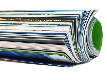 Curved magazine isolated on white background の写真素材