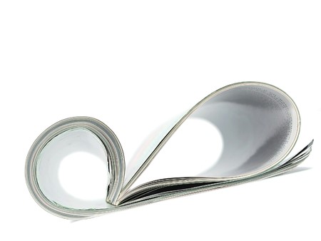 Curved magazine isolated on white background の写真素材